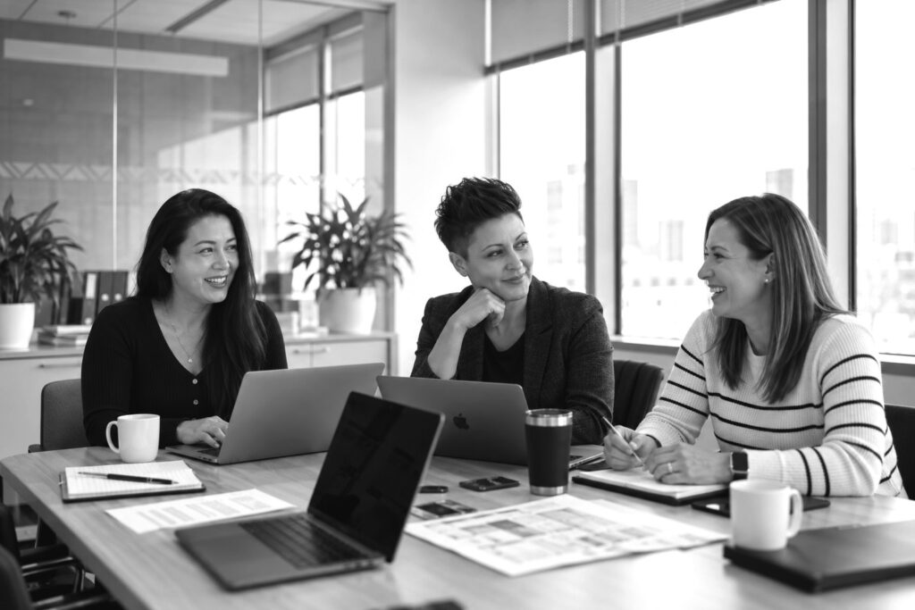 Laura Lambert, Tessa Blair and Shanna Lin of Salesmatic in a working session at the office