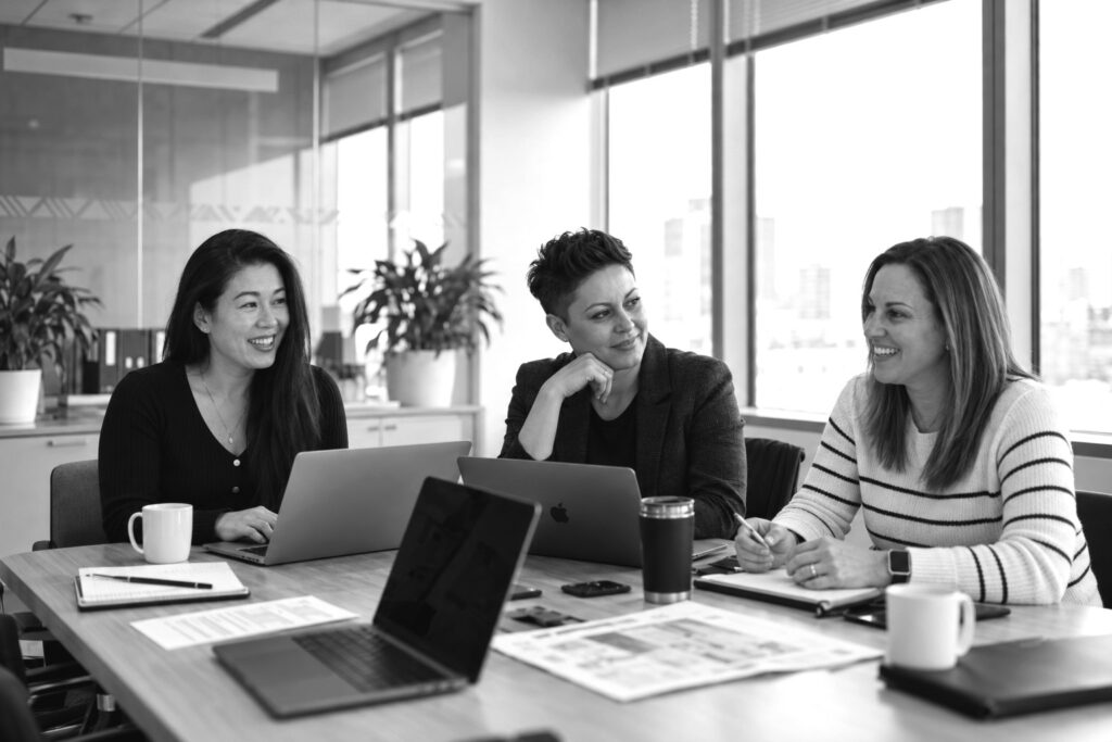 Laura Lambert, Tessa Blair and Shanna Lin of Salesmatic in a working session at the office